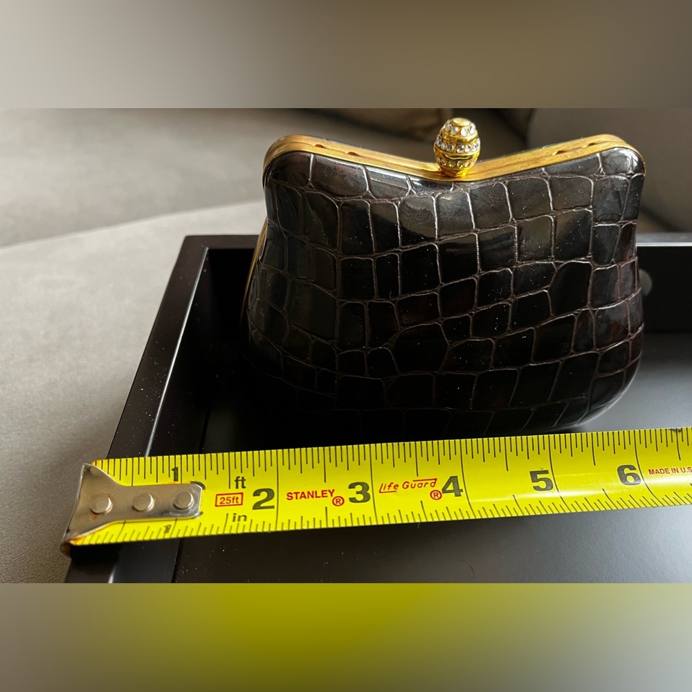Orly Dinner/party clutch in Brown croc print with stone closure.